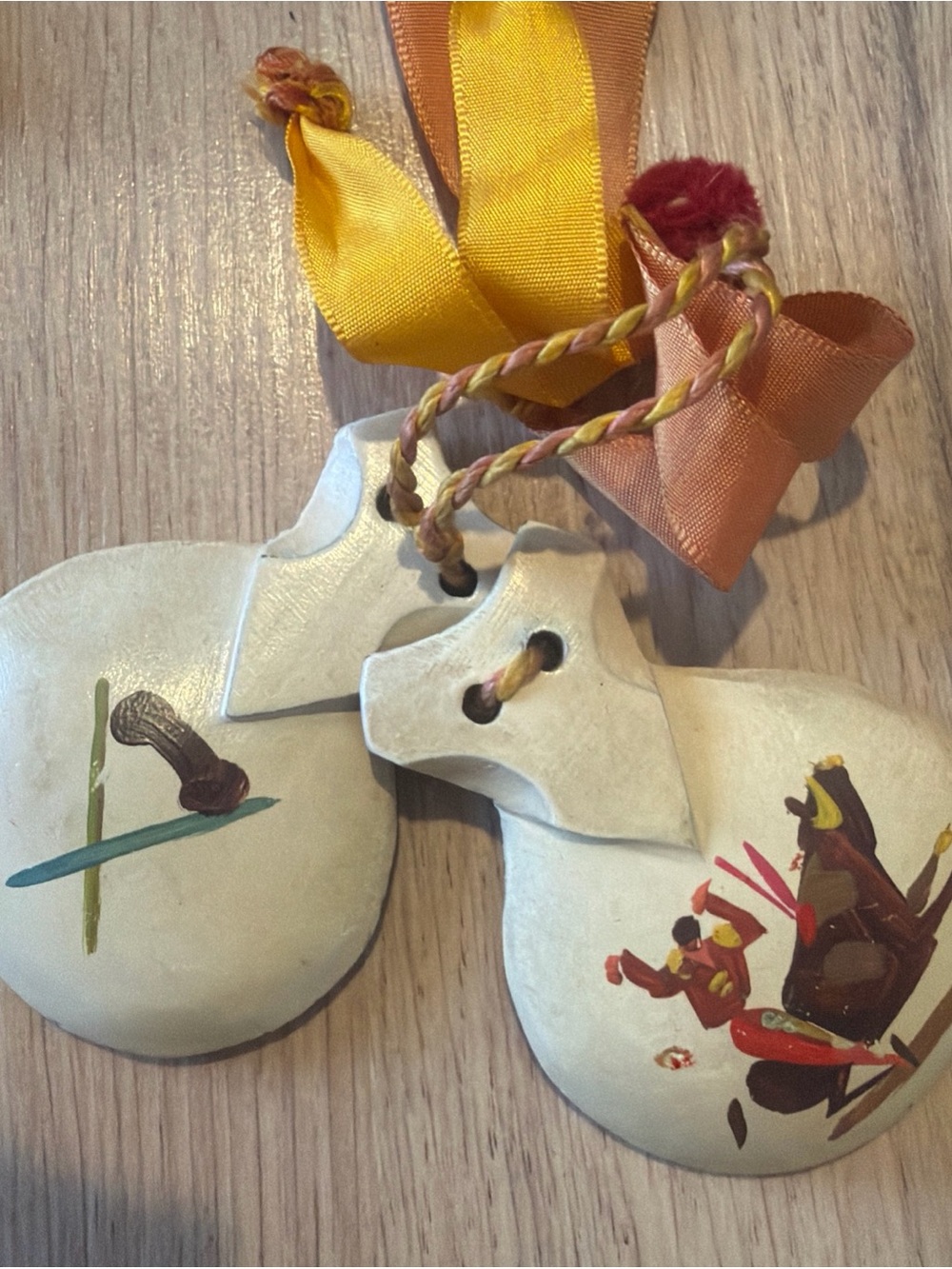 Hand carved and Painted White Castanets with Yellow & Orange Ribbon